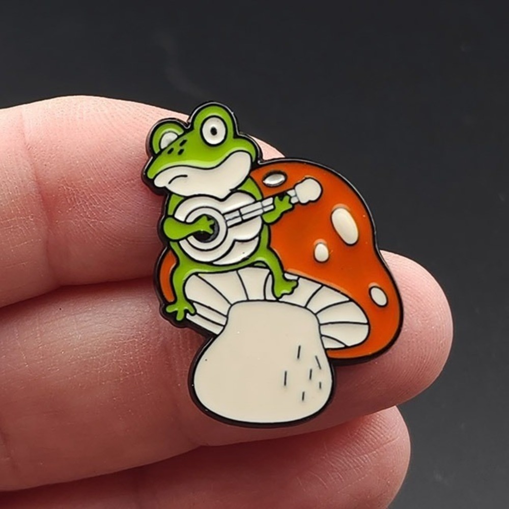 Frog Pin, Playing‎ Music Ukulele on a Mushroom toadstool, enamel pin
